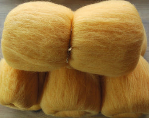 Hand carded Merino top dyed with Annatto and Soda Crystals