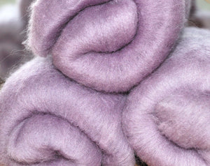 Hand carded Merino top dyed with Logwood and Soda Crystals.